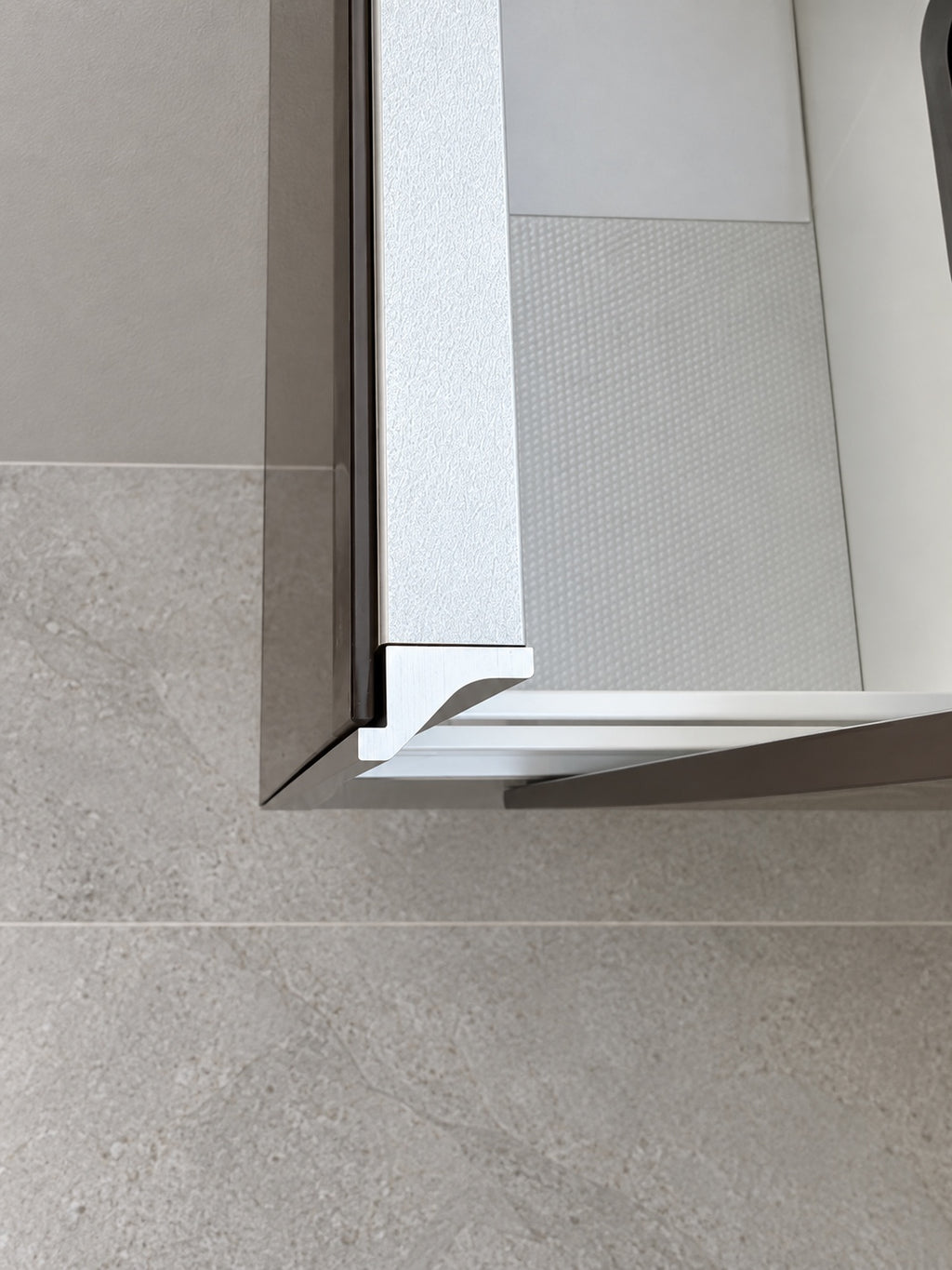 Keuco vanity pull-out compartment and aluminium handle detail