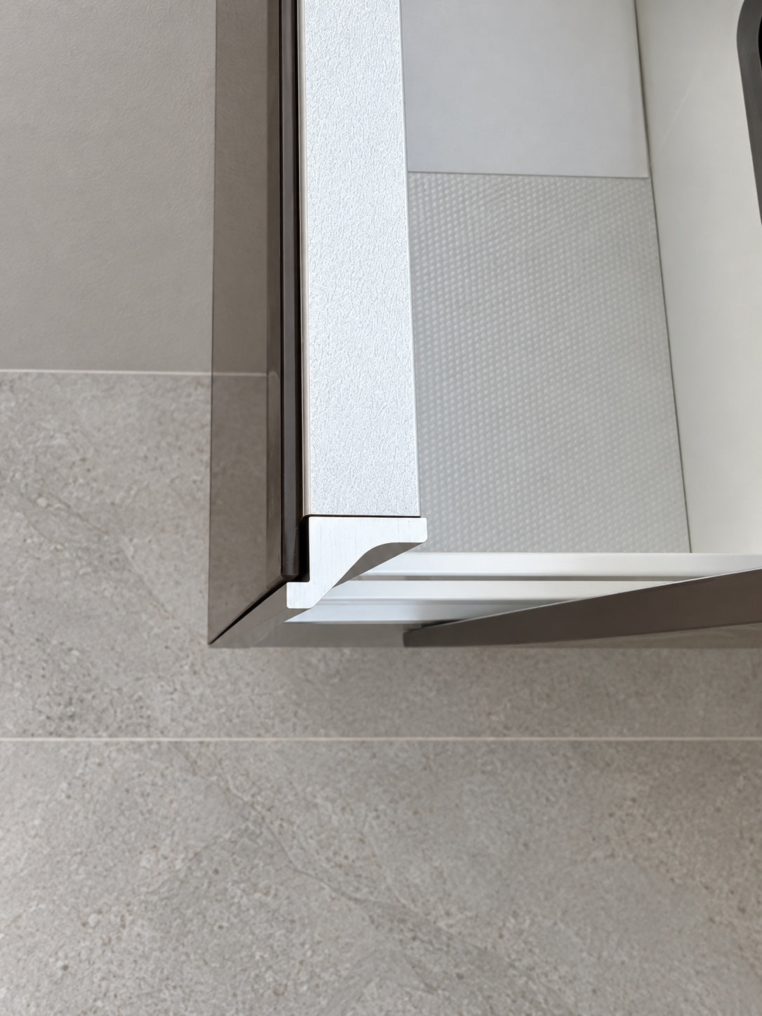 Keuco vanity pull-out compartment and aluminium handle detail
